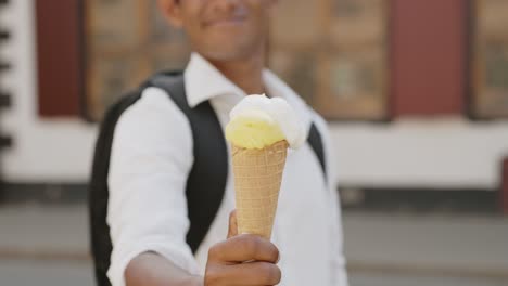 classy man holding and giving ice cream on hot summer day, sharing is caring