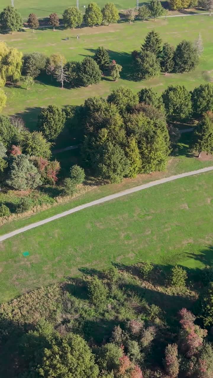 Vertical aerial drone shot at Cheshunt Golf Course, Herts. Begins down the fairway before reverse panning left, smoothly revealing the green and trees that surround the peaceful course landscape