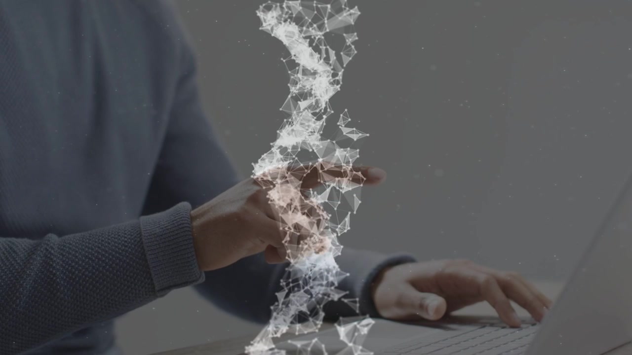 Uomo che digita e gesticola sul laptop mentre una colonna di particelle appare e pulsa vicino alla mano per la tecnologia.