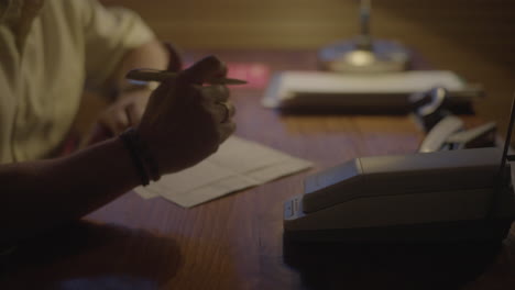 people working at a desk at night