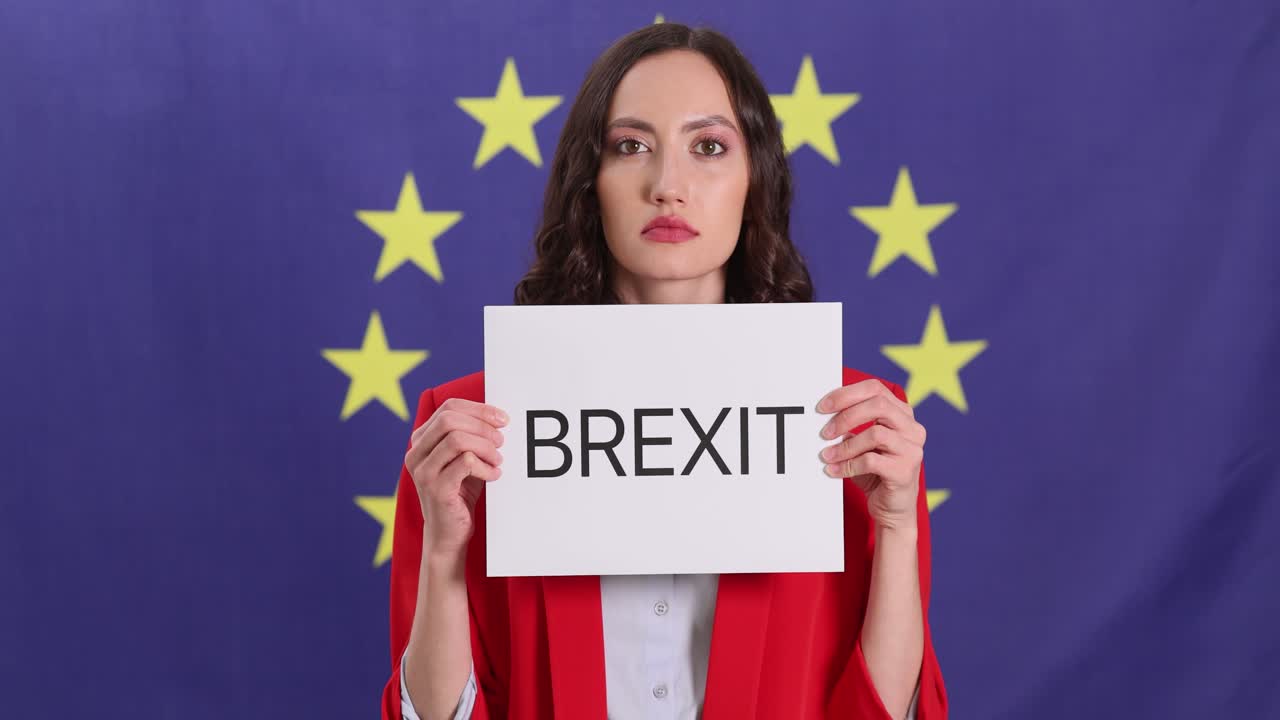 Woman holding Brexit sign in front of EU flag