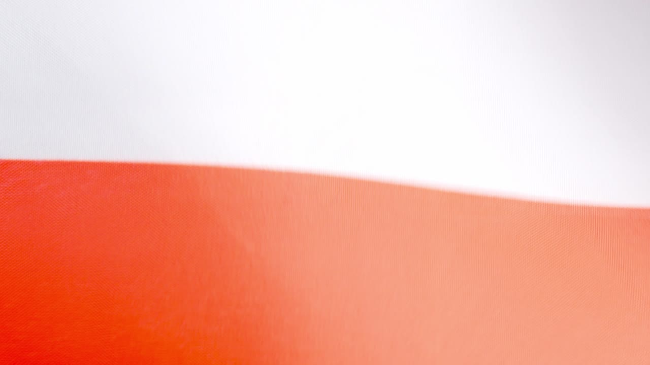 Polish national flag waving by the wind