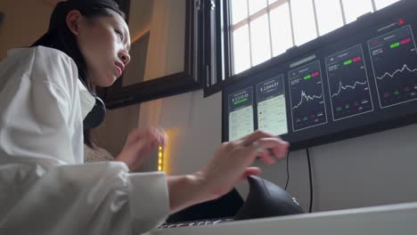 serious ethnic female trader analyzing cryptocurrency market statistics