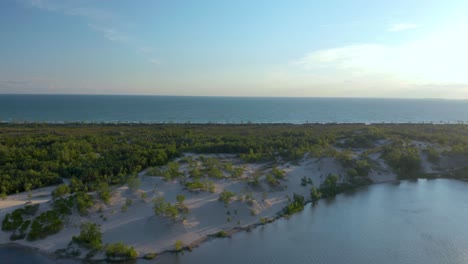 drone flying over the lake ontario and the sandbanks peninsula