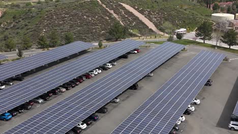 parking lot structure with solar panels sustainable energy - ascending aerial