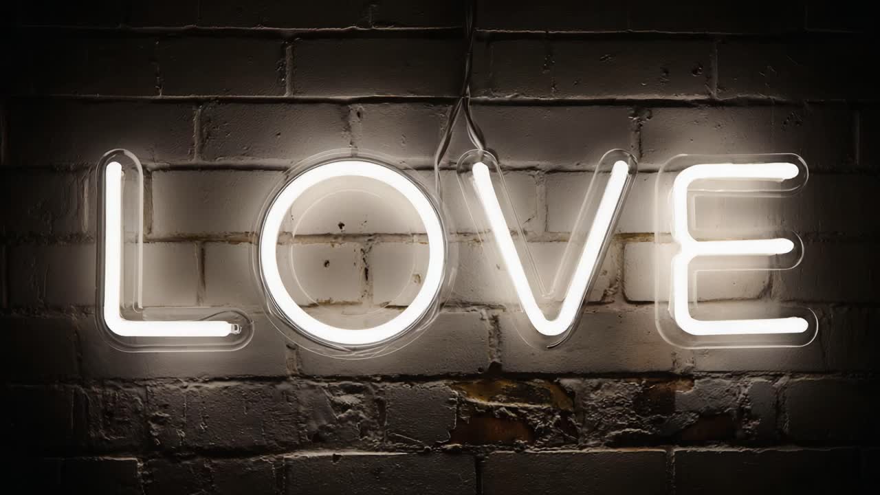 A Captivating Glimpse of a Neon 'LOVE' Sign Illuminating a Dark Background, Perfect for Portraying Themes of Affection, Romance, and Connection in Any Setting