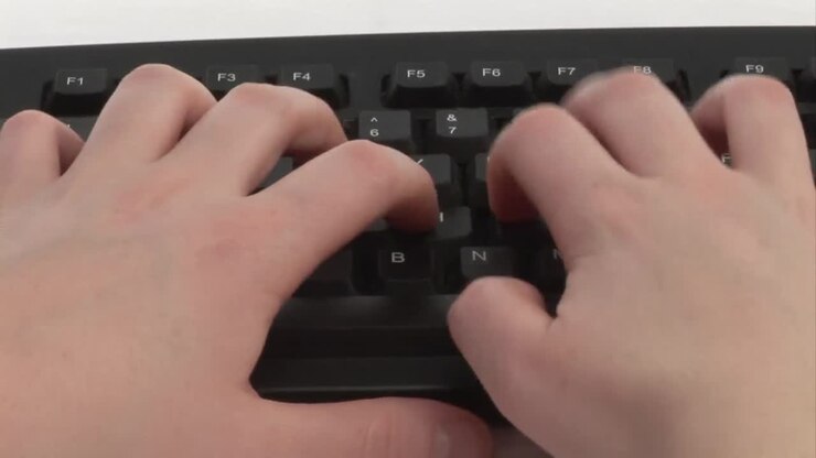 Woman Typing on Keyboard