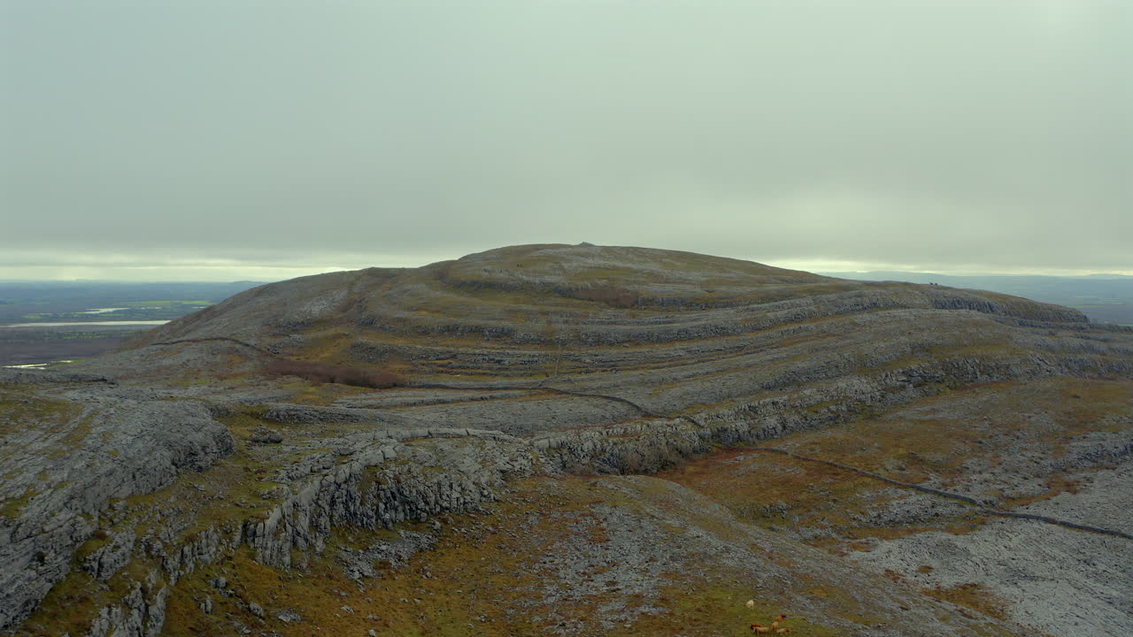 Aerial dolly of Mullaghmore summit, one of the most iconic hills in Burren National Park