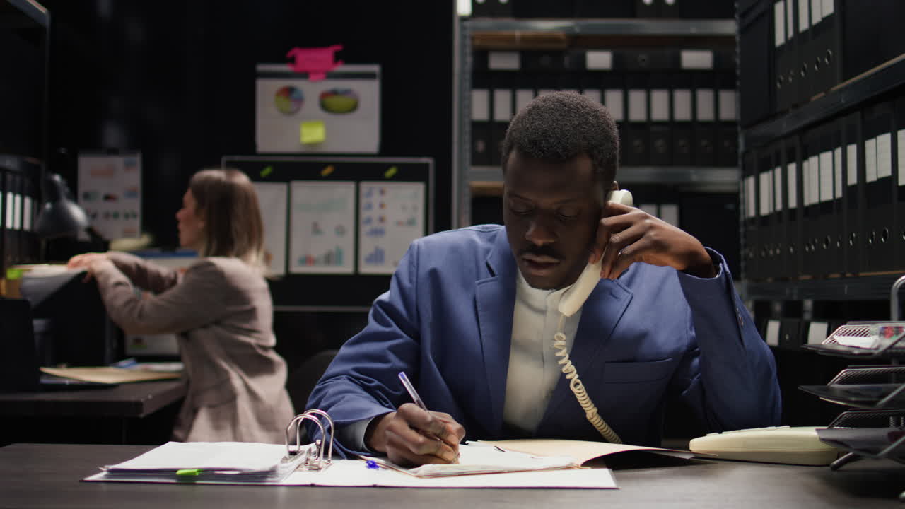 Two people working in an office