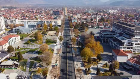 traffic on a main street of a modern city drone shot