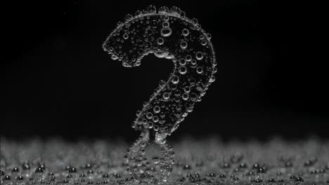 question mark made of water bubbles on black background
