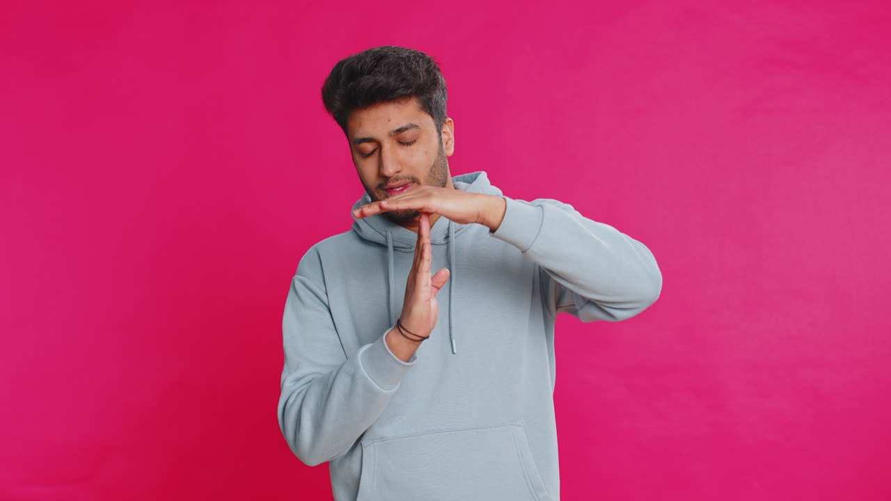 Tired upset indian man showing pause gesture limit or stop sign time ...