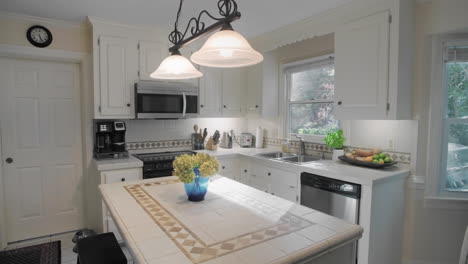 gimbal shot of and empty white kitchen in the suburbs