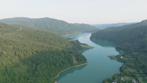 forested mountain ranges at doftana river in prahova county, muntenia, romania