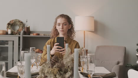 female artist taking picture of decorated table