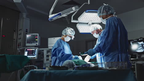 Doctors,-team-and-surgery-in-theater-with-medical