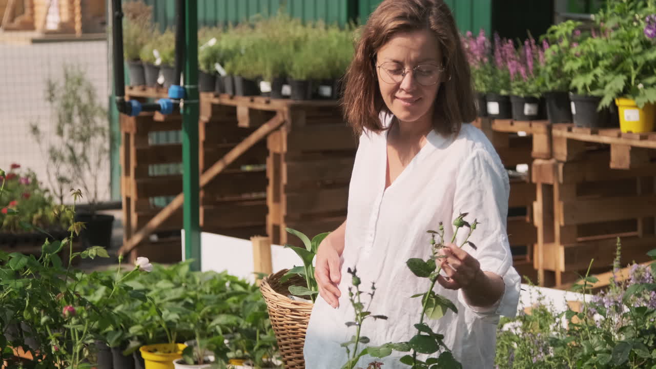 Woman Shopping for Plants at a Greenhouse