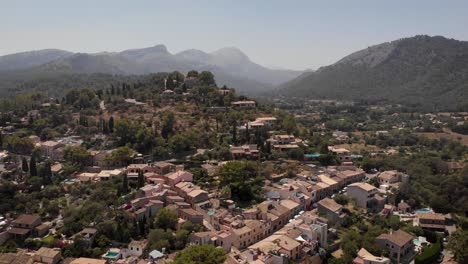 aerial: overview shot of beautiful village on the hills in mallorca