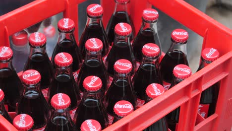 crate of coca-cola bottles