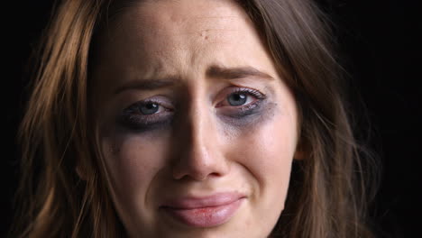 Studio-Portrait-Shot-Of-Unhappy-Woman-With-Smudged-Make-Up