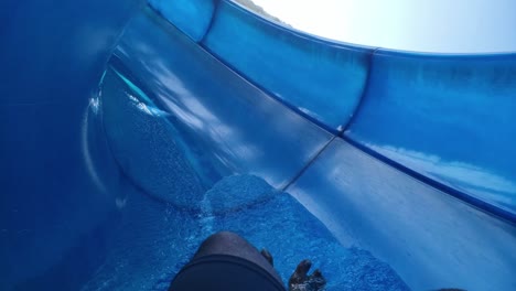 going down the slip and slide at the water park