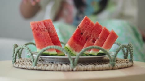 child eating watermelon slices