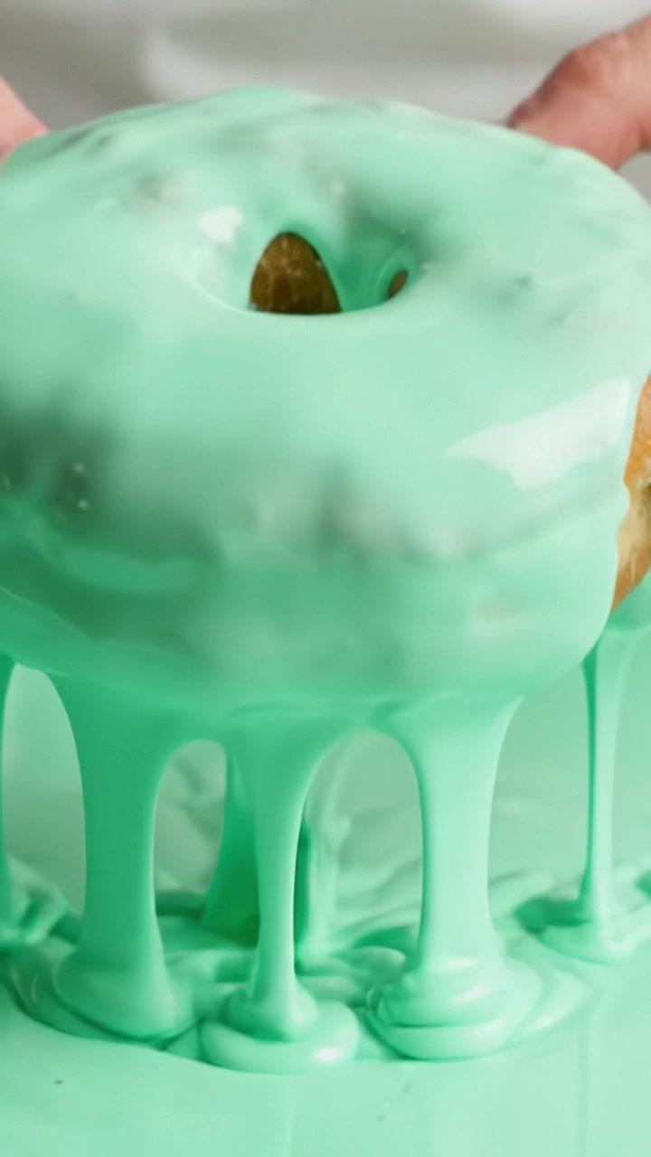 A Step-by-Step Journey of Creating Delicious Mint Glazed Donuts with Smooth Icing and Artistic Toppings, Showcasing the Perfect Glaze Technique in Every Detail.