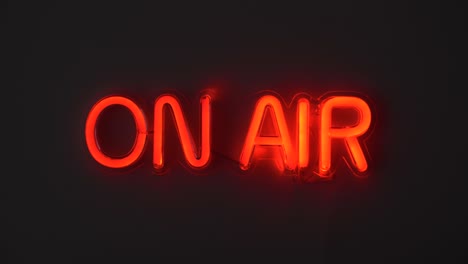 red on air sign being turned on and being turned off