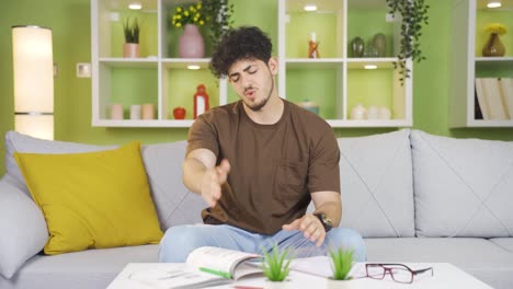 young college student is sick and tired of studying.