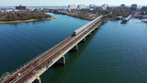 an aerial shot over grassy bay in queens, ny