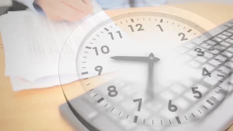 animation of clock moving over hands of caucasian businesswoman writing