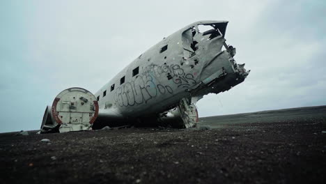 abandoned airplane wreckage in iceland's volcanic landscape