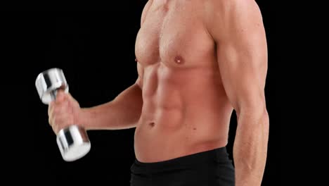 MId-section-of-muscular-man-lifting-dumbbells