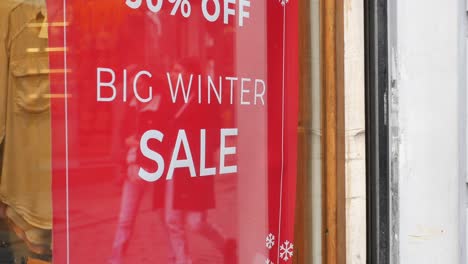 big winter sale sign in store window