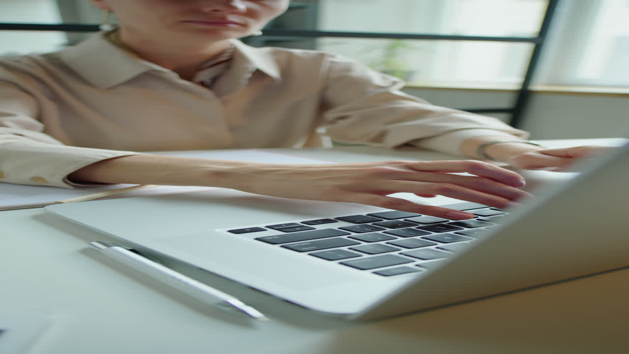 Businesswoman Typing on Laptop