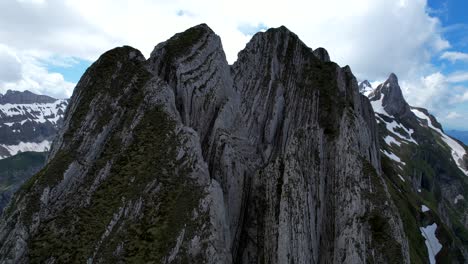 4k drone aerial rare close up view of jagged peaks at shäfler ridge in appenzell region of switzerland