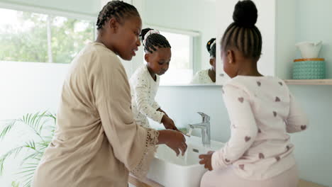 Family,-black-mother-and-girls-brushing-teeth