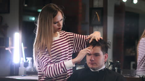 client visiting hairstylist in barber shop