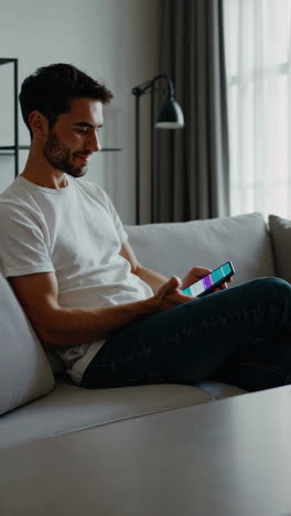 person using a smartphone while relaxing on a couch