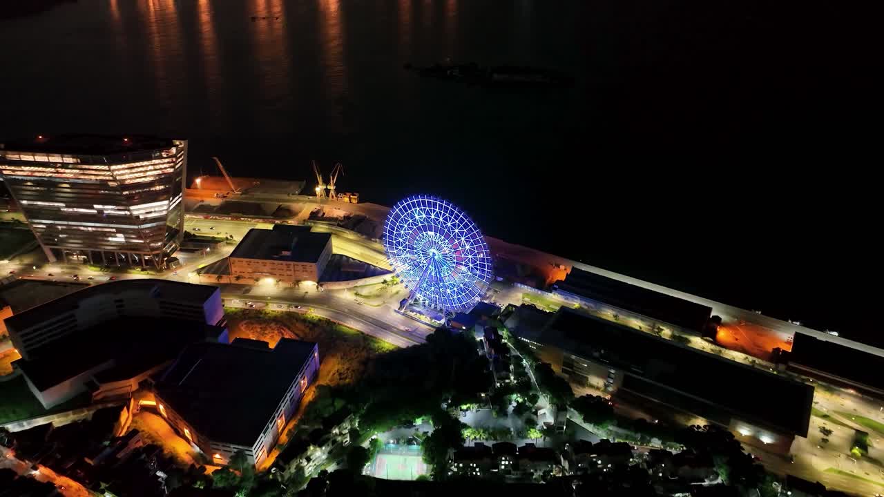 Night scape of Rio de Janeiro Brazil. Panorama of illuminated downtown district of Rio de Janeiro Brazil. Buildings and avenue at harbor zone landmark of city. Famous Rio de Janeiro capital city.