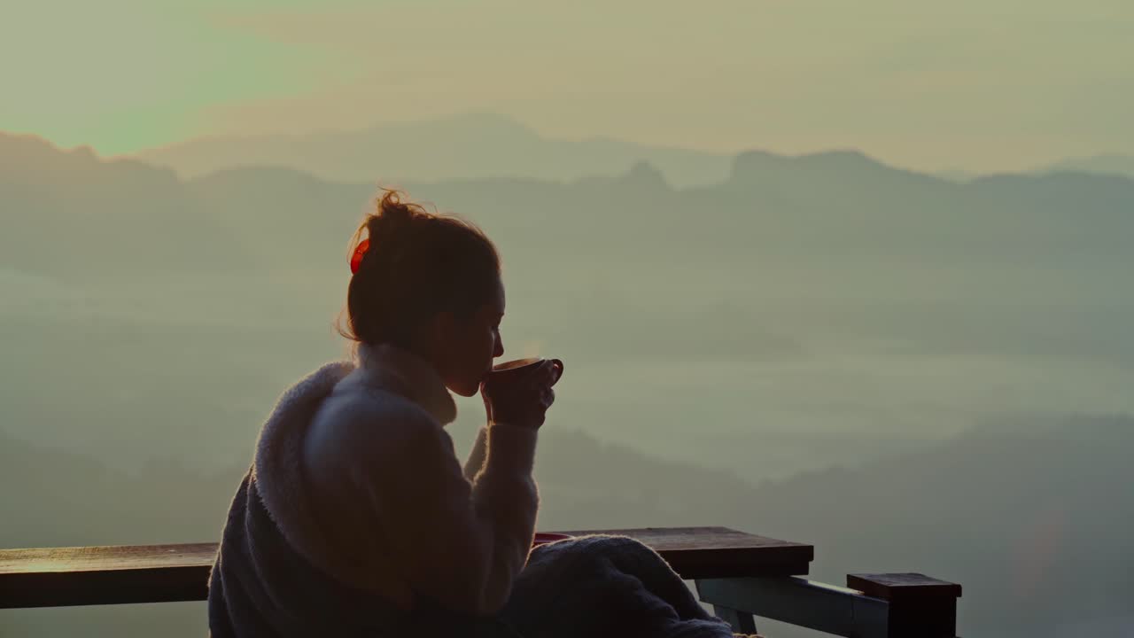 Woman Drinking Coffee Enjoying Mountain View at Sunrise