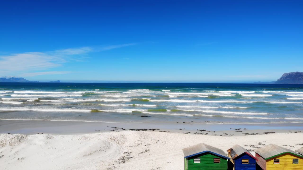 Sunny Beach With Rolling Waves And Colorful Huts On White Sand, Azure Sky Meeting Distant Islands, Surf. Media