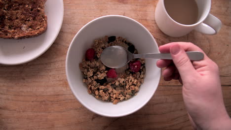 point of view shot of person eating breakfast at table