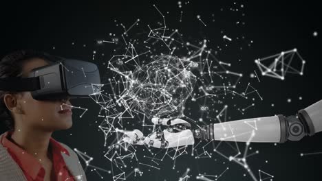 mujer usando auriculares vr con brazo de robot