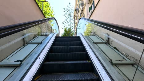 ascending escalator to a bustling street view