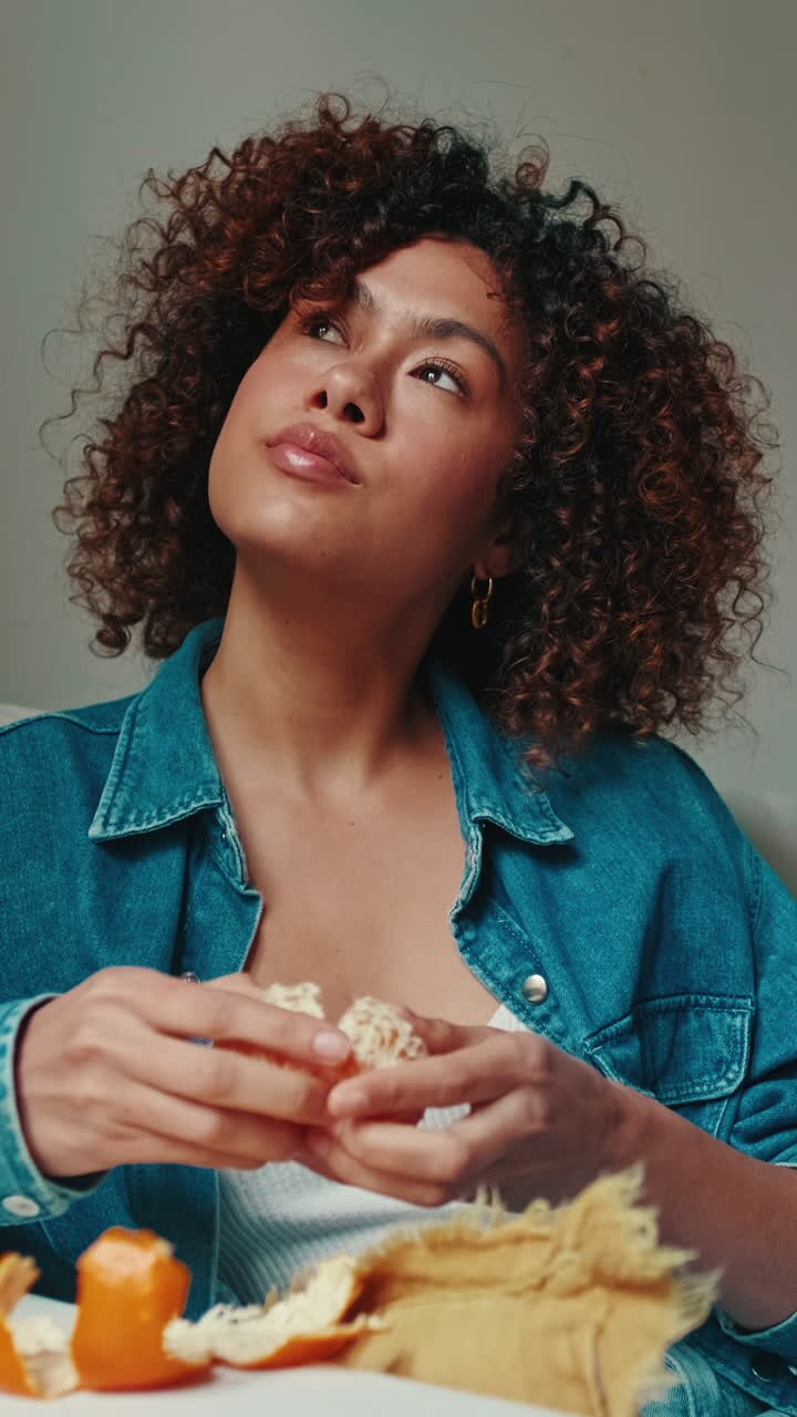 Woman Eating Citrus Fruit