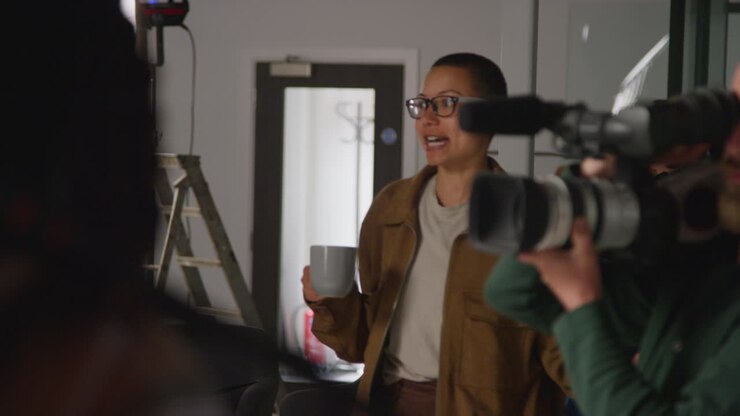Woman being interviewed on a film set