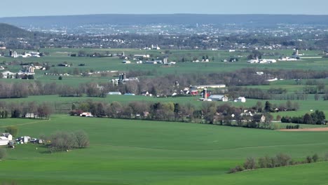 Panoramic-drone-shot-of-green-farm-fields-in-countryside-of-USA