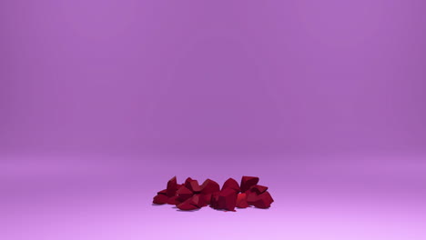 Red-minimalistic-heart-falling-on-ground-and-breaking-into-pieces