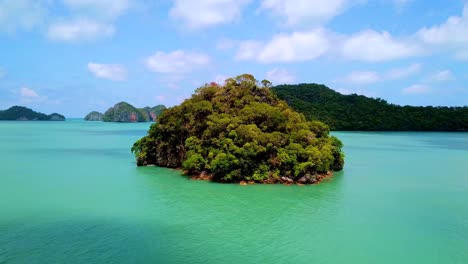 turquoise blue sea surrounded by a set of paradise islands in a sunny day in langkawi, malaysia